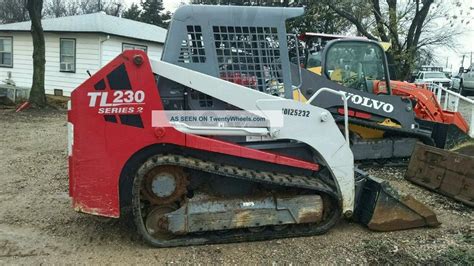 how to raise cab on tl230 takeuchi skid steer|skid steer cab lift.